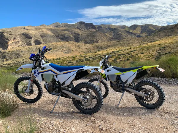 two husqvarna fe 450 in the desert